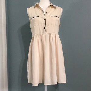Cream dress with faux leather piping